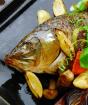 Boiled carp in Volga style Carp baked with vegetables